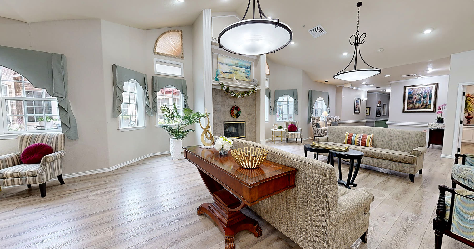 Lounge seating with sofas and armchairs in a bright common area